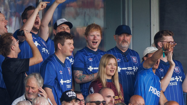 English singer and songwriter Ed Sheeran (C) watches the English Premier League match between Ipswich Town and Liverpool in Ipswich, Britain, 17 August 2024